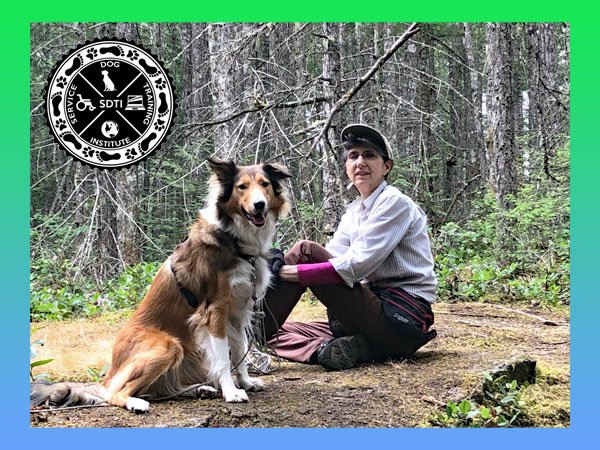 Service dog training instructor with dog outside in park.